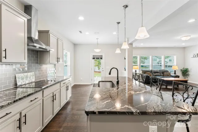 a view of yard with swimming pool and trees