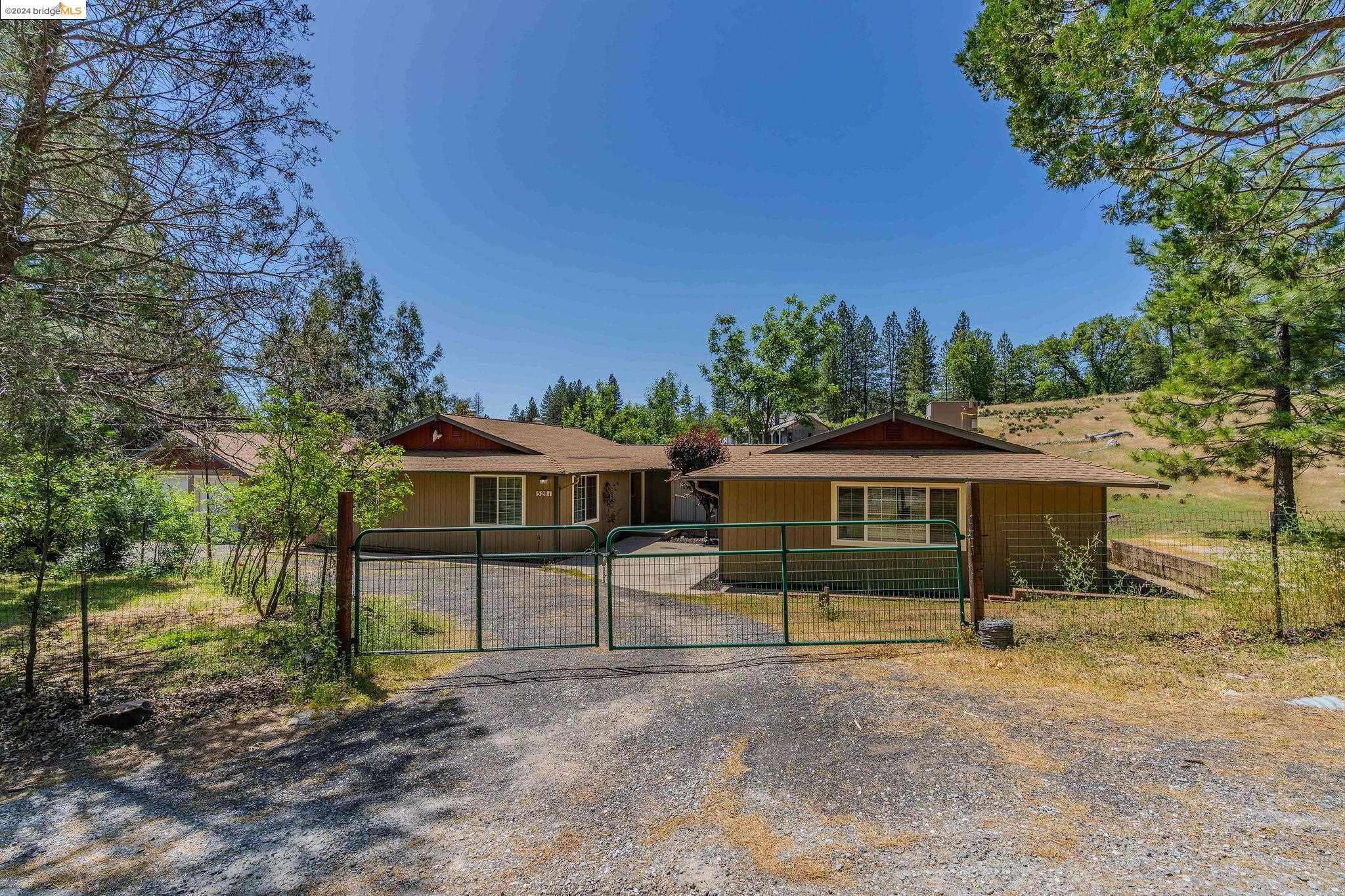 5201 Loma Serena Road Mountain Ranch, CA 95246 - Photo 1 of 1 a view of a house with backyard and a tree