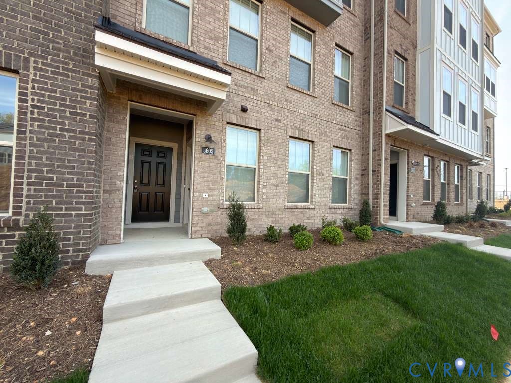3605 Edna Path, Unit A Henrico, VA 23233 - Photo 2 of 20 a front view of a brick house with a yard