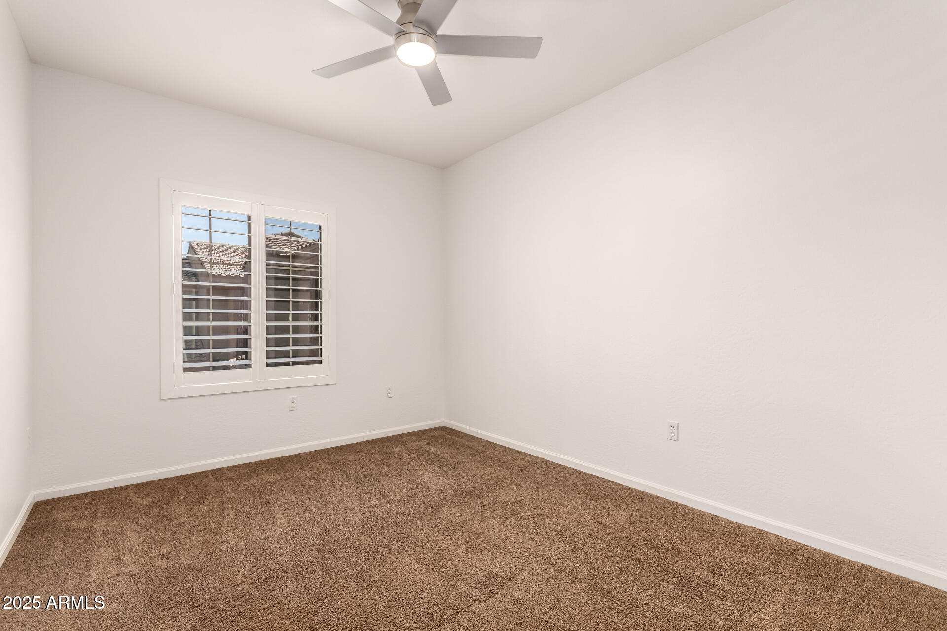 3935 East Rough Rider Road, Unit 1076 Phoenix, AZ 85050 - Photo 22 of 48 an empty room with a window
