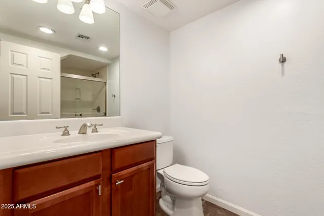a bathroom with a glass shower door