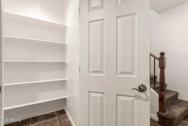 a view of a storage and utility room with closet