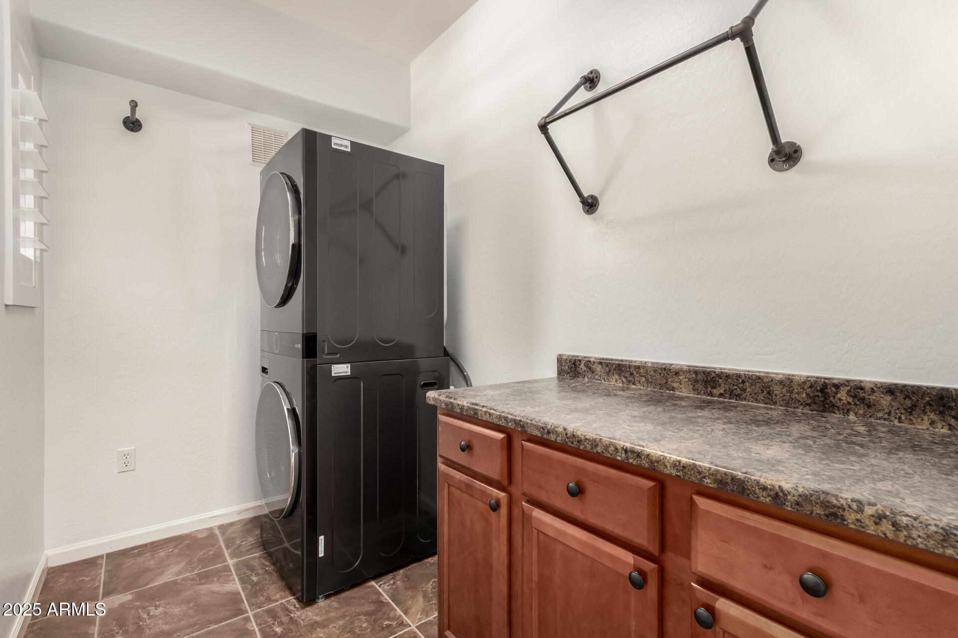 3935 East Rough Rider Road, Unit 1076 Phoenix, AZ 85050 - Photo 30 of 48 a view of a storage and utility room with closet