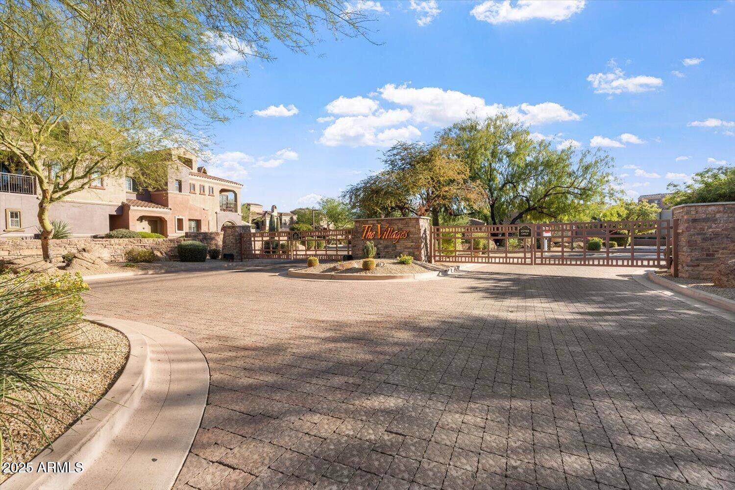 3935 East Rough Rider Road, Unit 1076 Phoenix, AZ 85050 - Photo 35 of 48 a view of city street with tall buildings