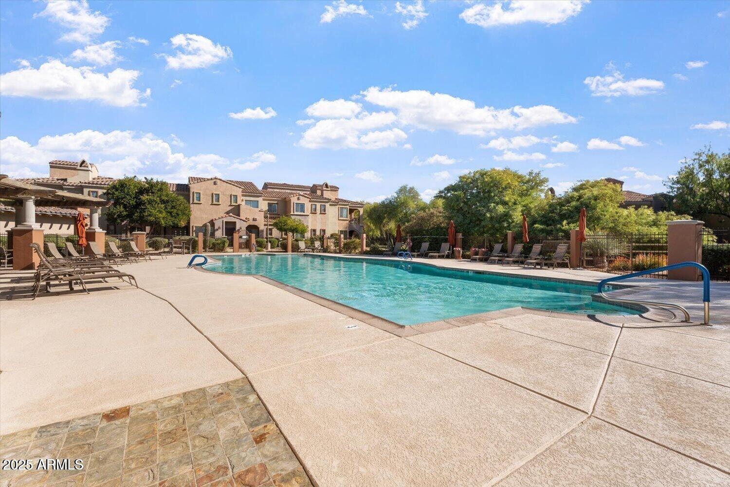 3935 East Rough Rider Road, Unit 1076 Phoenix, AZ 85050 - Photo 39 of 48 a view of outdoor space swimming pool and outdoor seating