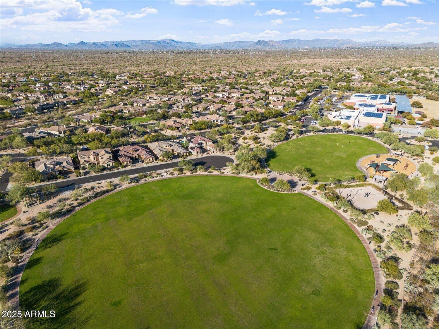 3935 East Rough Rider Road, Unit 1076 Phoenix, AZ 85050 - Photo 46 of 48 an aerial view of residential houses with outdoor space