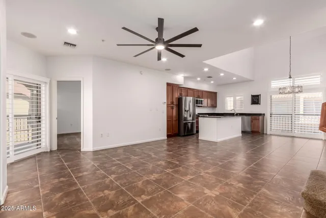 a view of a kitchen with a sink and cabinets