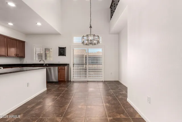 a view of a kitchen with granite countertop cabinets and appliances