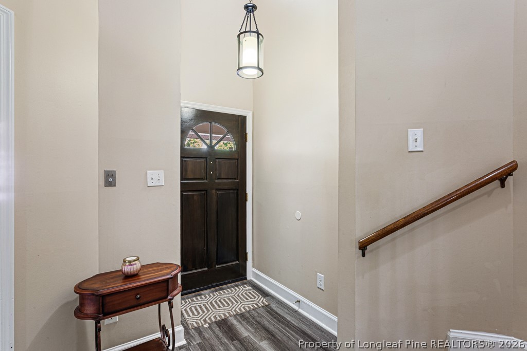461 Lands End Road Fayetteville, NC 28314 - Photo 6 of 31 a view of a hallway with wooden floor and a potted plant