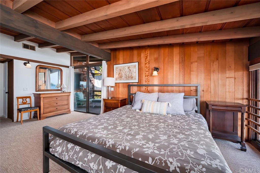 1944 Ocean Way Laguna Beach, CA 92651 - Photo 13 of 25 a bed sitting in a bedroom next to a window