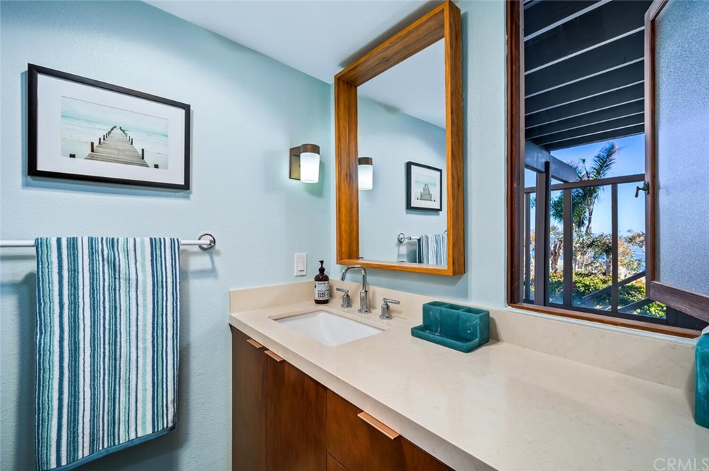 1944 Ocean Way Laguna Beach, CA 92651 - Photo 17 of 25 a bathroom with a sink and a mirror
