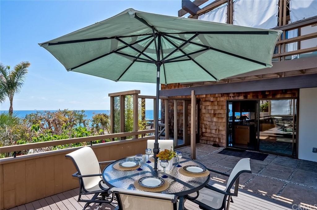 1944 Ocean Way Laguna Beach, CA 92651 - Photo 7 of 25 a view of a patio with a table and chairs under an umbrella