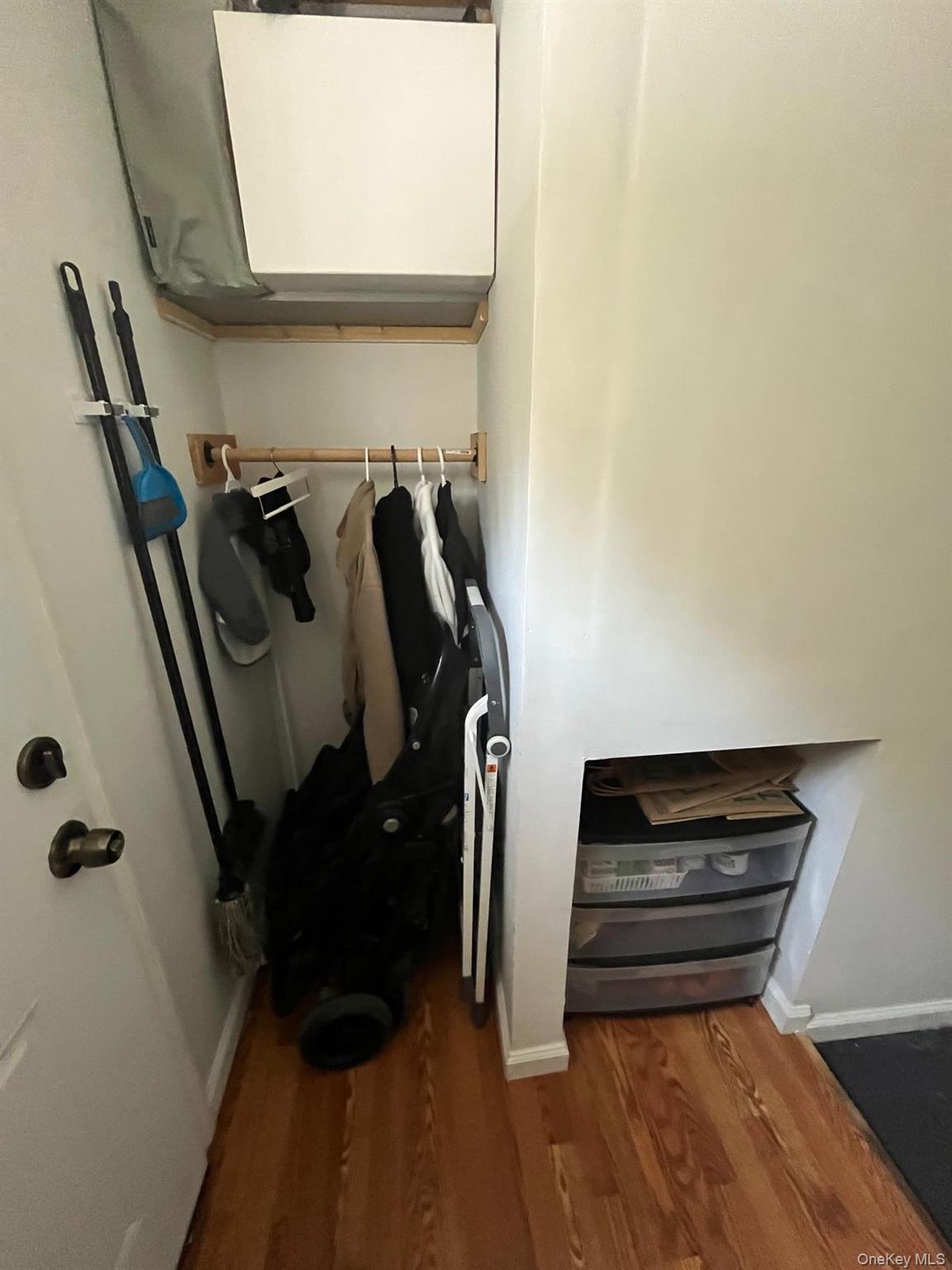 354 Beachview Street Copiague, NY 11726 - Photo 14 of 24 a view of walk in closet with clothes and shoes