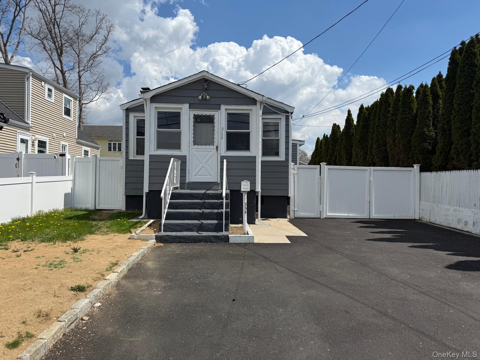 354 Beachview Street Copiague, NY 11726 - Photo 7 of 24 a view of a house with a yard