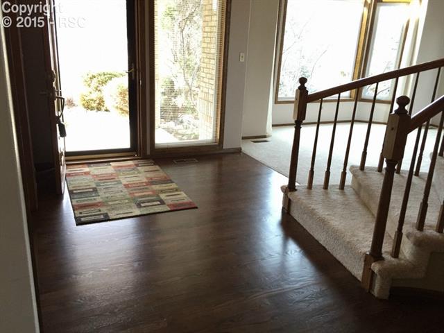915 Forest View Road Monument, CO 80132 - Photo 3 of 35 newly refinished oak hardwood floors
