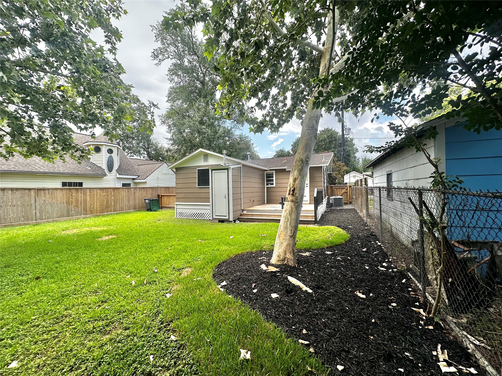 202 Fannin Street Tomball, TX 77375 - Photo 23 of 24 Back yard with nice trees