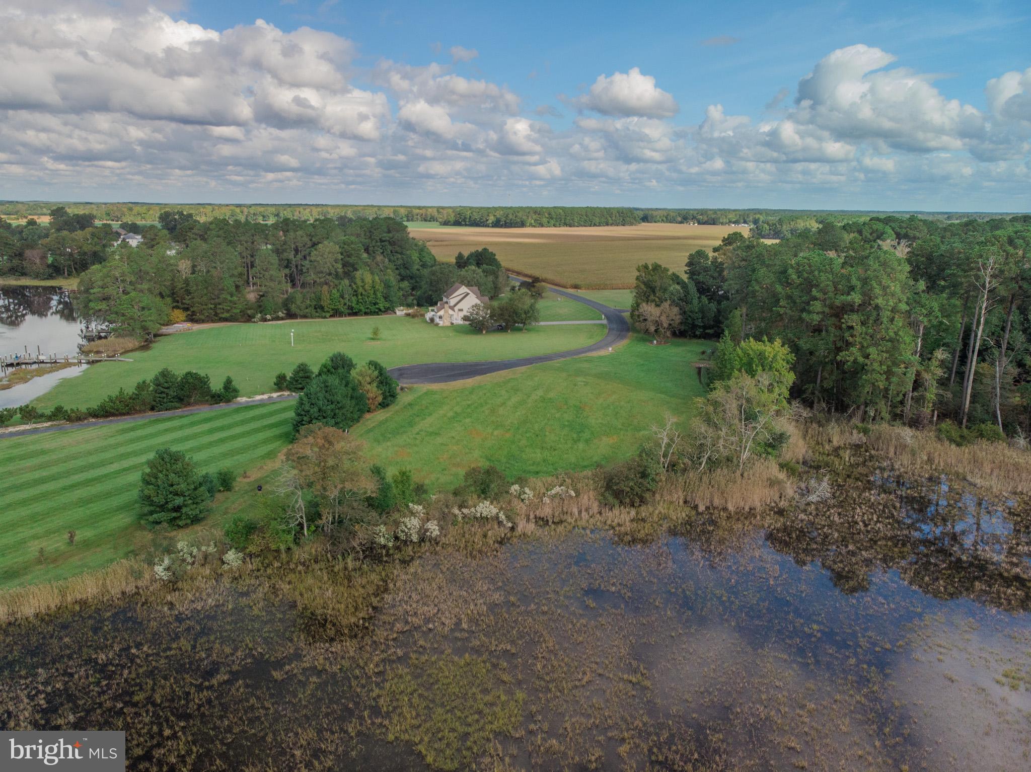 a view of a lake with a yard