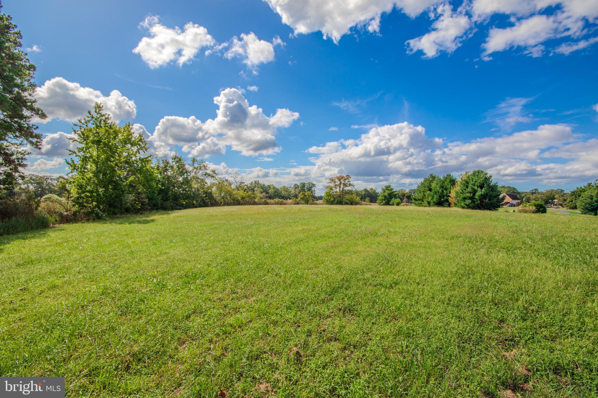 12465 Mallard Landing Road Princess Anne, MD 21853 - Photo 3 of 15 a view of a building in the middle of a field