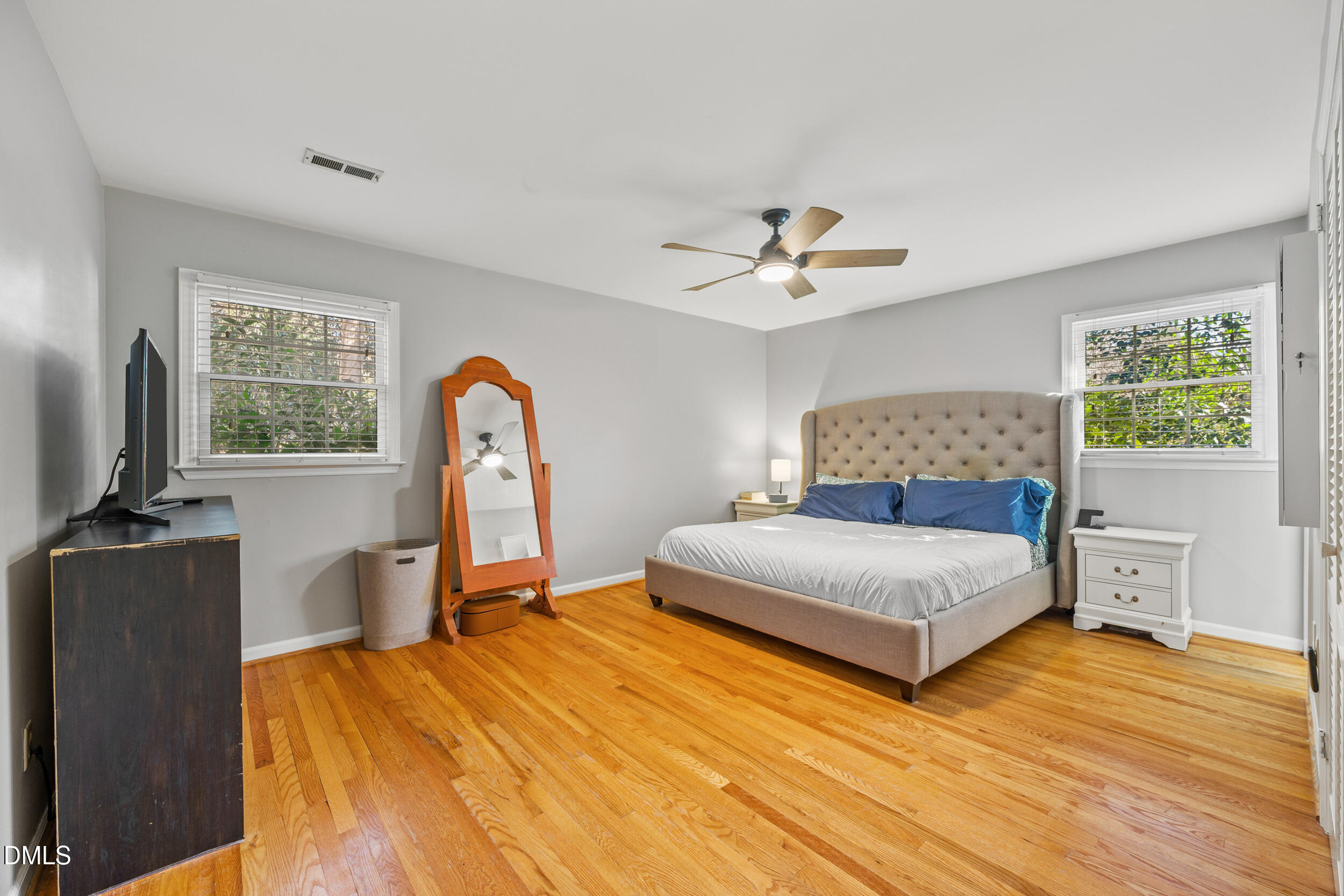 3726 Swift Drive Raleigh, NC 27606 - Photo 18 of 40 a bedroom with a bed and a chandelier