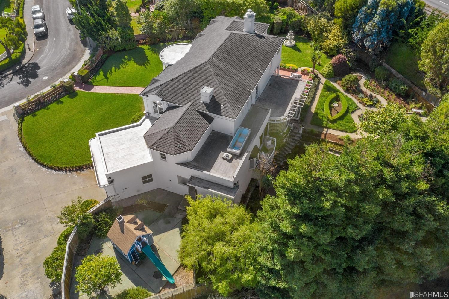 100 Stonecrest Drive San Francisco, CA 94132 - Photo 5 of 98 an aerial view of a house with a garden and trees