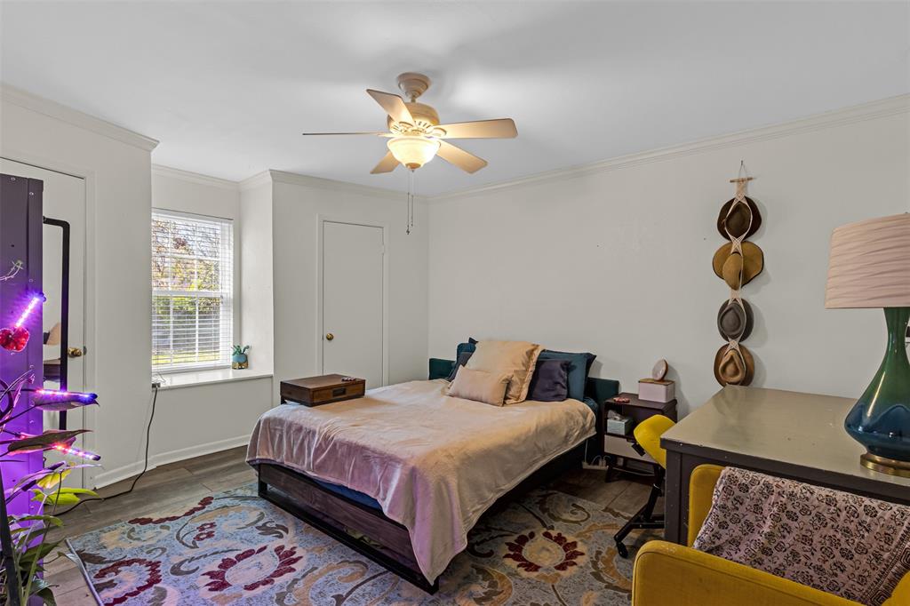 1495 Snider Lane Lucas, TX 75002 - Photo 18 of 39 a bedroom with a bed and cabinets