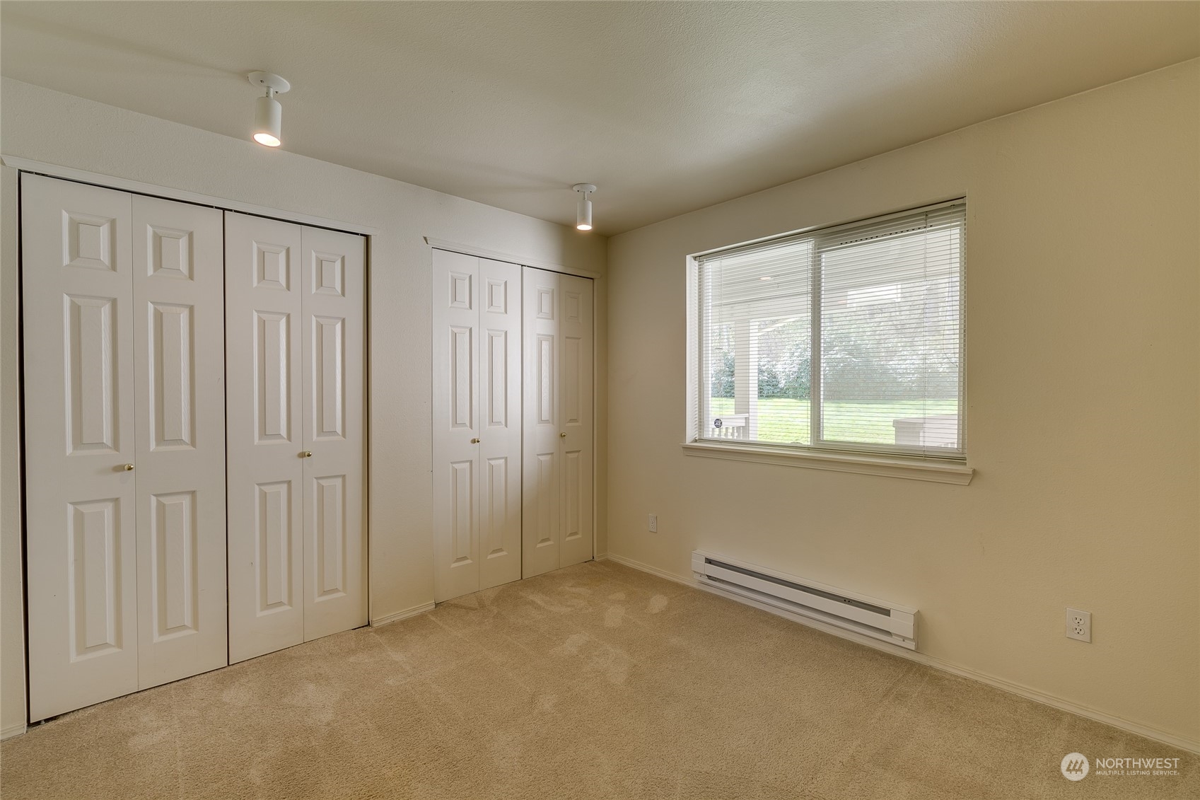 15711 Waynita Way Northeast, Unit H203 Bothell, WA 98011 - Photo 14 of 22 an empty room with windows