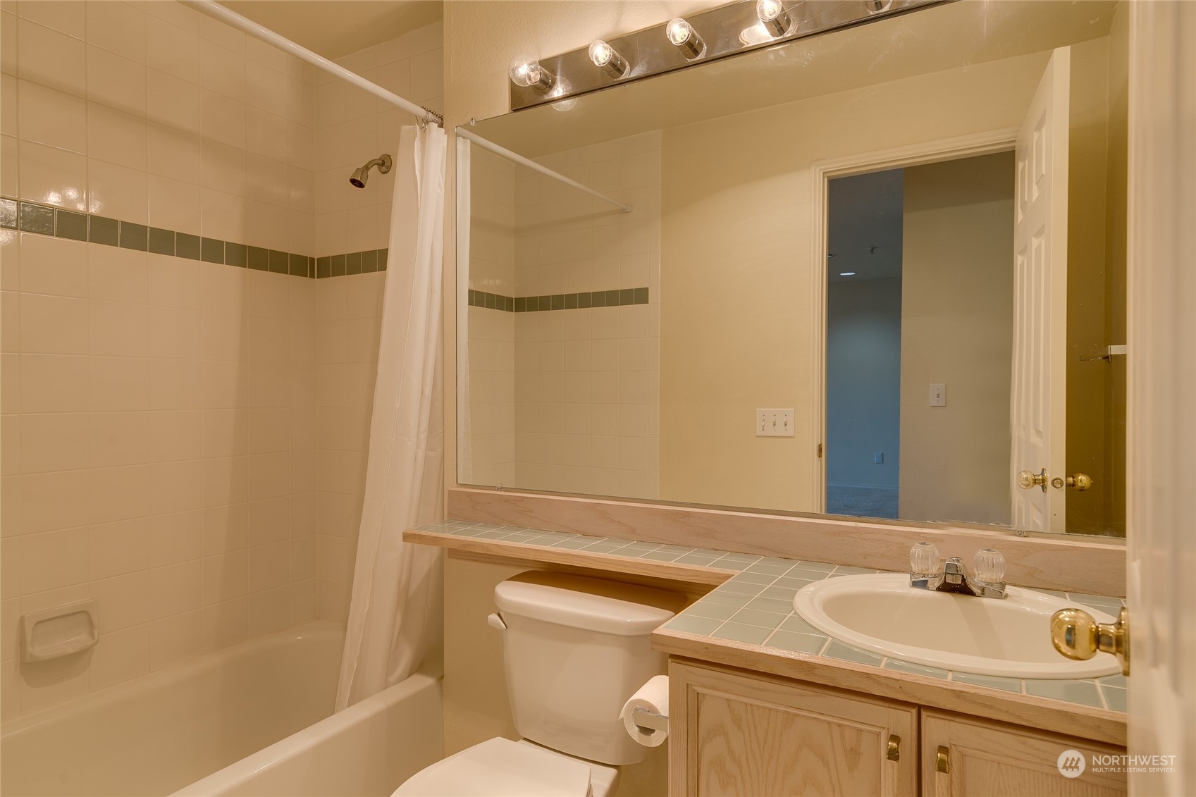 15711 Waynita Way Northeast, Unit H203 Bothell, WA 98011 - Photo 16 of 22 a bathroom with a sink toilet and shower