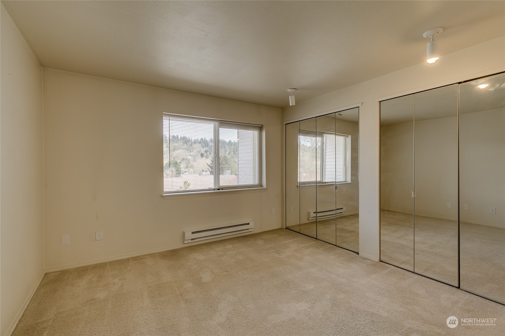 15711 Waynita Way Northeast, Unit H203 Bothell, WA 98011 - Photo 18 of 22 a view of an empty room with a window