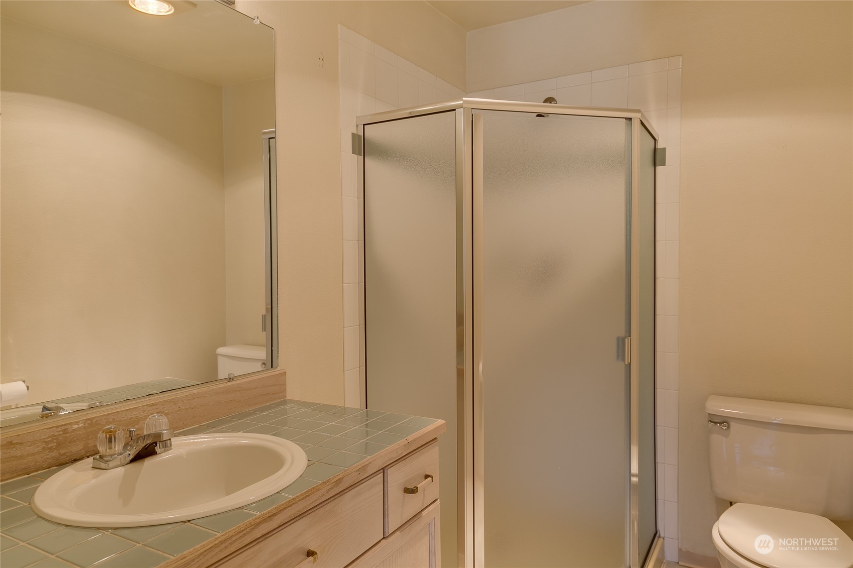 15711 Waynita Way Northeast, Unit H203 Bothell, WA 98011 - Photo 19 of 22 a bathroom with a sink toilet and a mirror