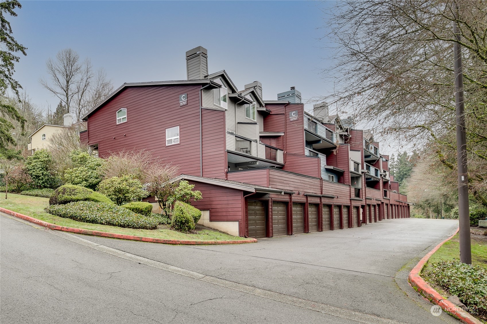 15711 Waynita Way Northeast, Unit H203 Bothell, WA 98011 - Photo 2 of 22 a front view of a house with a yard