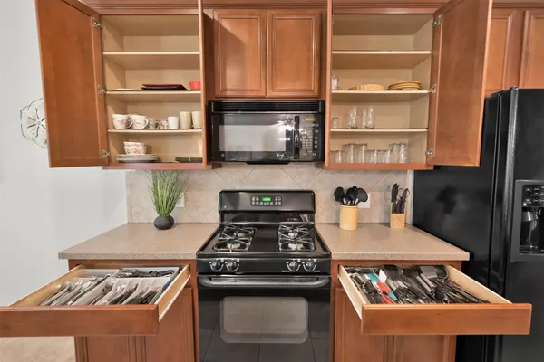 a kitchen with a stove and a refrigerator