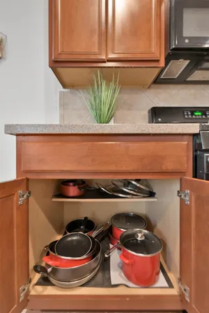 a kitchen with a stove and cabinets