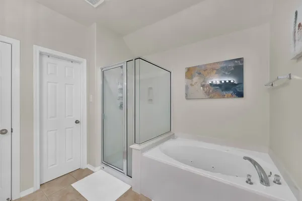 a bathroom with a bathtub and a shower