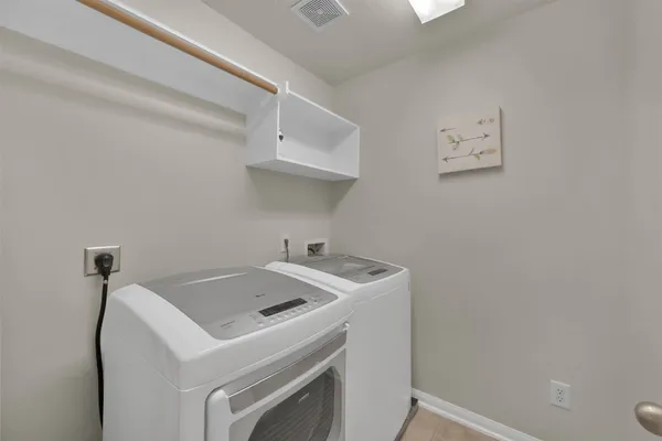 a utility room with dryer and washer