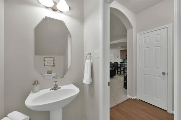 a bathroom with a sink and a mirror