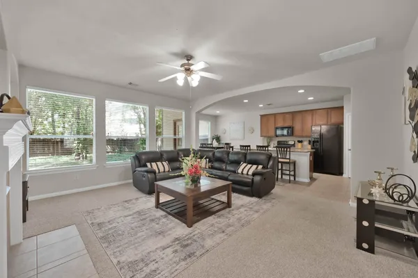 a living room with furniture and a large window