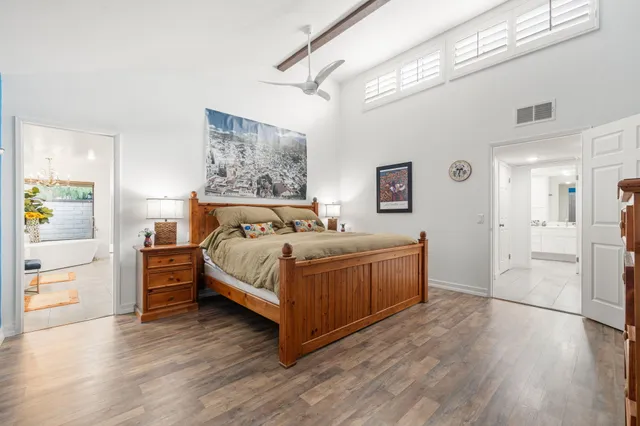 a bed room with a bed and a dresser