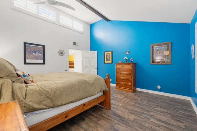 a white bath tub sitting in a bathroom next to a window
