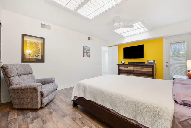 a bedroom with a bed and a couch