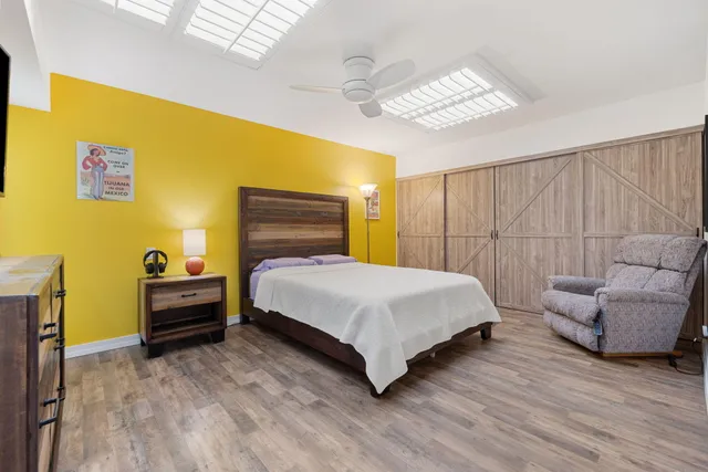 a view of a hallway with wooden shelves