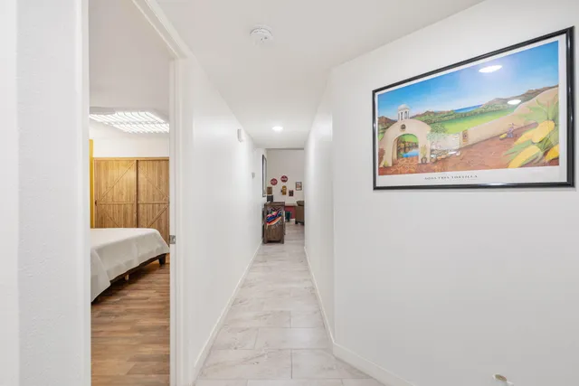 a bathroom with a double vanity sink mirror and toilet