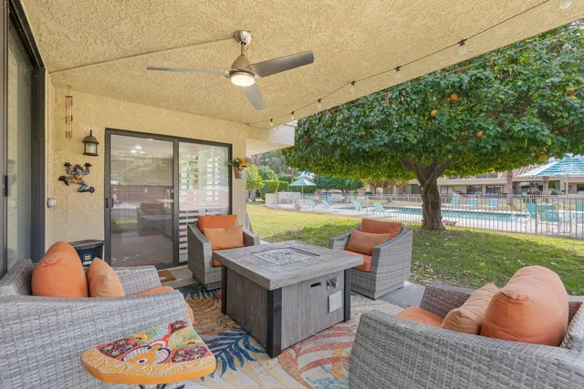 a view of a swimming pool with outdoor seating