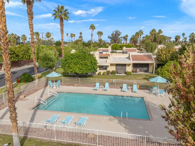 a view of a swimming pool with a patio
