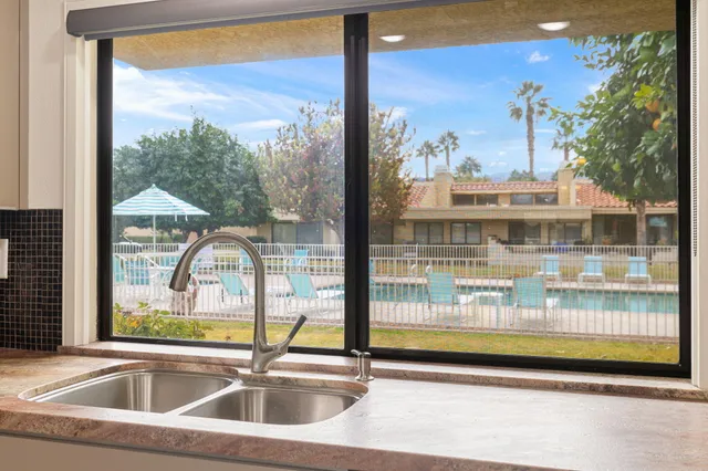 a view of a room with a floor to ceiling window