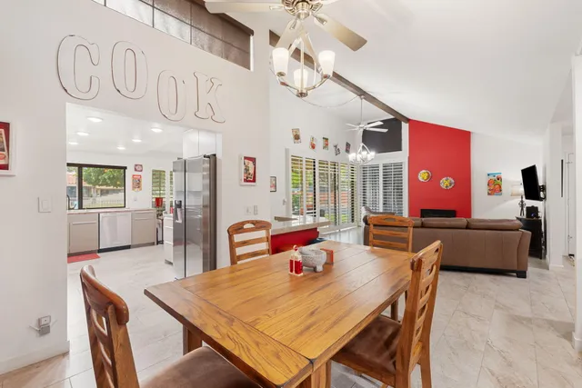 a view of a dining area with furniture and a chandelier