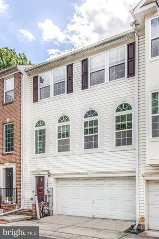 a front view of residential houses with street
