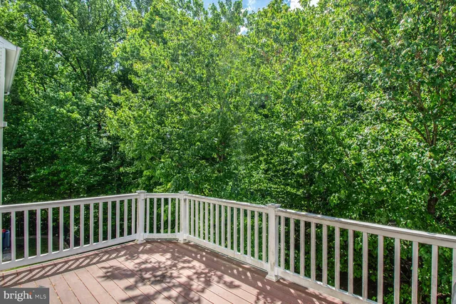 a balcony with trees in front of it