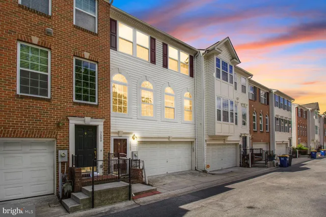 a view of a building with a bench in front of building