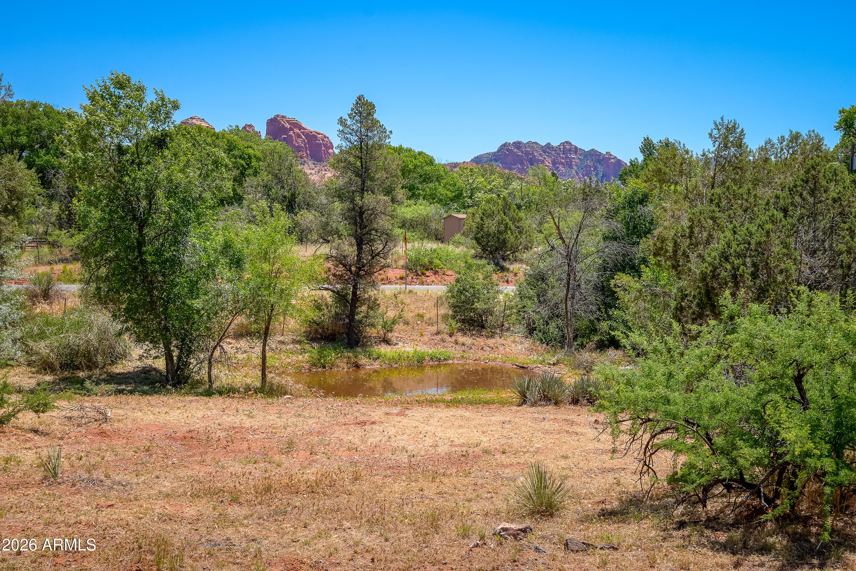 3155 Red Rock Loop Road, Unit 1 Sedona, AZ 86336 - Photo 14 of 18 a view of a yard