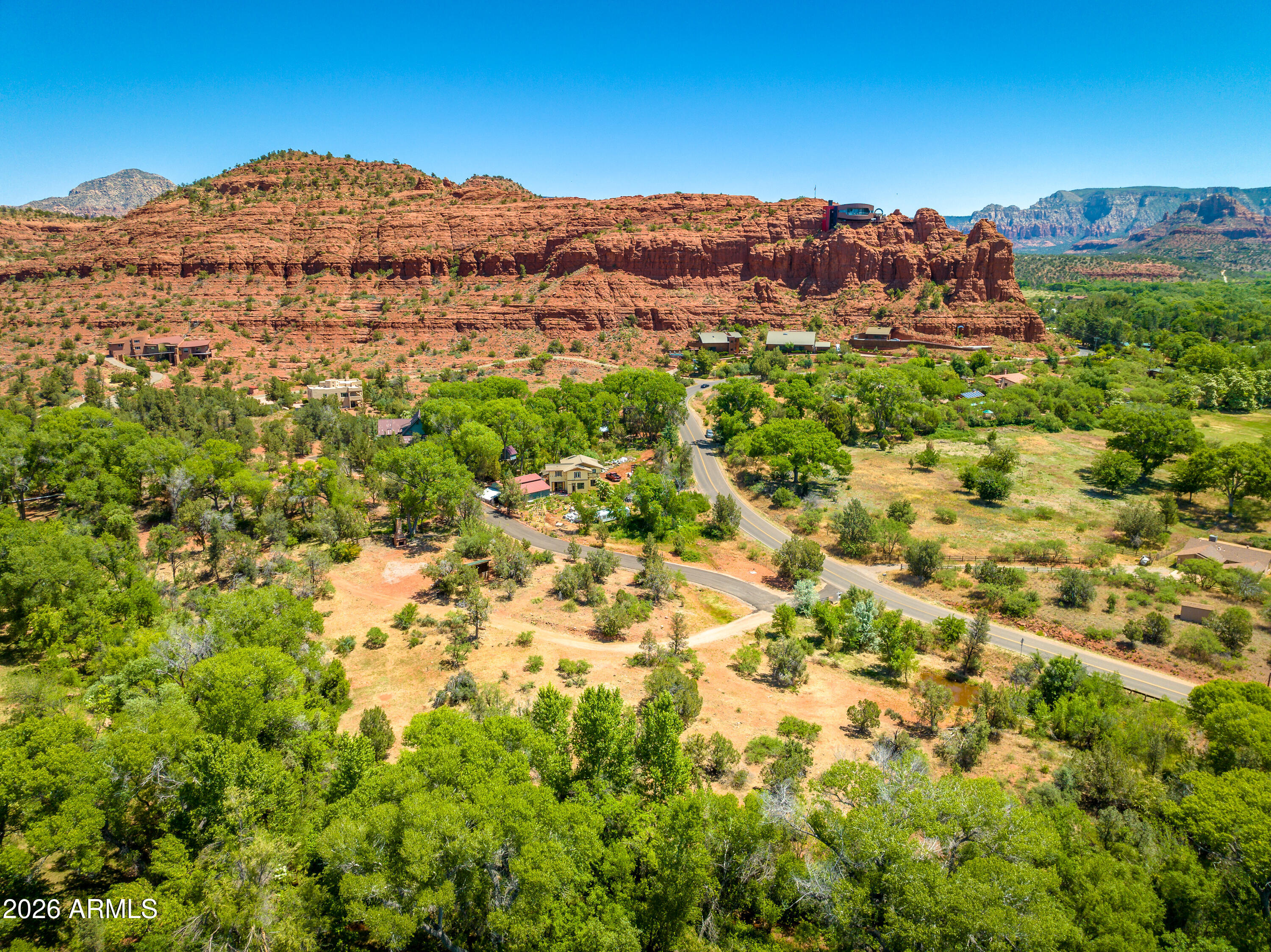3155 Red Rock Loop Road, Unit 1 Sedona, AZ 86336 - Photo 3 of 18 a view of a city with mountains in the background